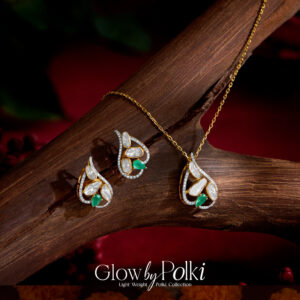 Leaf-shaped lightweight Polki pendant set with green accents by Regal Jewellers