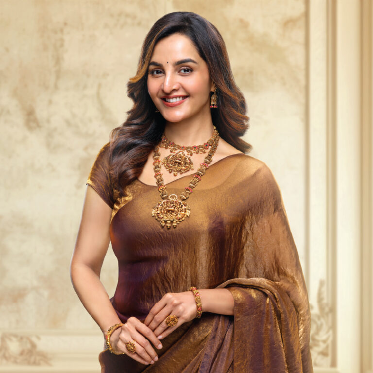 Manju Warrier, brand ambassador of Regal Jewellers, wearing a handcrafted Nagas gold temple jewellery set featuring antique motifs and intricate carvings inspired by South Indian heritage.
