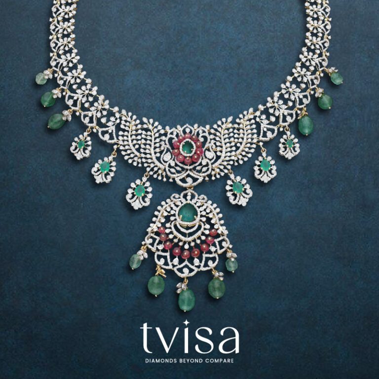Diamond necklace from the Tvisa Collection by Regal Jewellers, featuring green and red stones with emerald drop hangings.