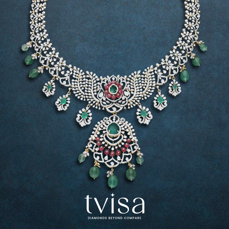 Diamond necklace from the Tvisa Collection by Regal Jewellers, featuring green and red stones with emerald drop hangings.