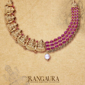Rangaura gemstone necklace by Regal Jewellers featuring handcrafted gold detailing, ruby stones, Lakshmi motifs, and a pearl drop — part of the Precious Gemstone Collection.