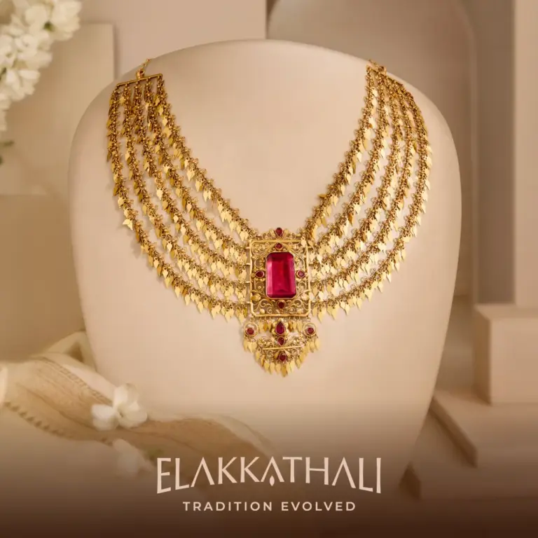 Elakkathali gold jewellery with traditional Kerala motifs and red stone detailing by Regal Jewellers